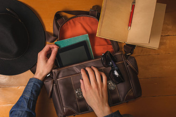 preparing vintage bag to travel on the floor