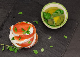 italian caprese with marjoram over slate