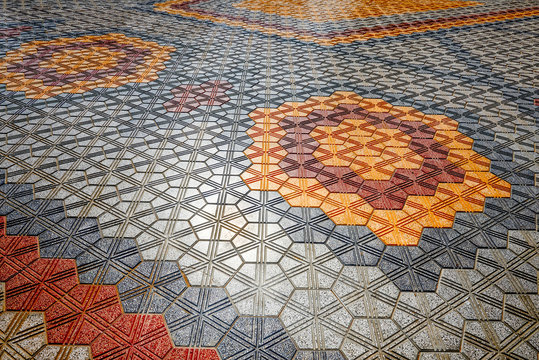 Colored interlock paving set out in geometric patterns