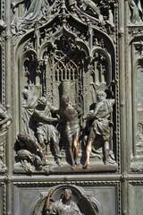Bronze door of the Milan cathedral detail
