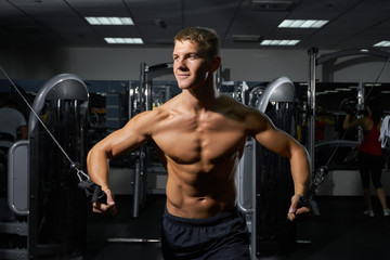 Fototapeta na wymiar Young bodybuilder in the gym