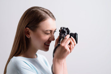 Positive smiling girl making photos