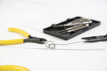 Pliers and screwdriver on white background