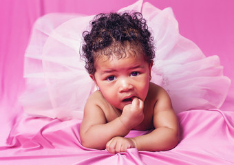 Lovely baby girl portrait wearing tut√π and looking at camera