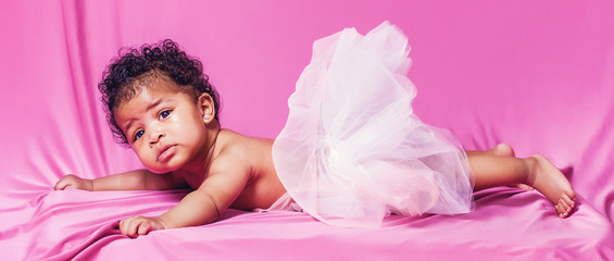 Lovely baby portrait wearing tut√π on pink background letterbox