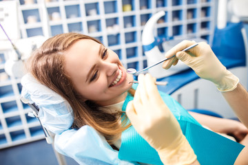 Overview of dental caries prevention.Woman at the dentist's chair during a dental procedure....