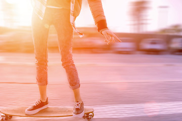 skater girl in action riding on skateboard