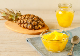 A bowl of canned pineapple on a table