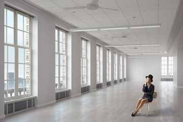 Businesswoman on chair in office