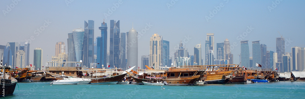 Wall mural dhows in front of the skyscrapers of new doha, qatar