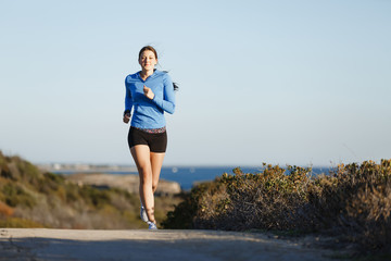 Sport runner jogging on beach working out