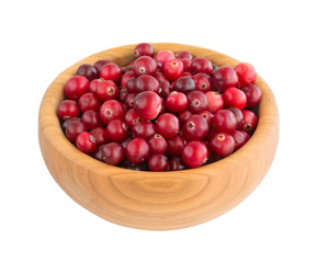 Cranberry berries in a wooden plate