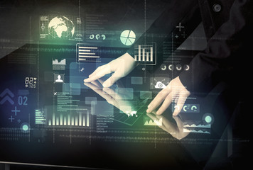 Businessman touching interactive modern desk with technology ico