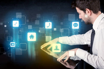 Modern smart table with high tech icons on its interface screen