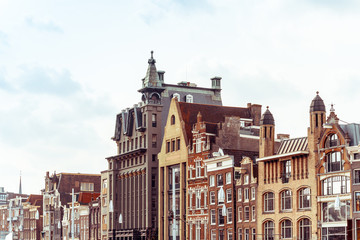 Fototapeta premium Beautiful street view of Traditional old buildings in Amsterdam,