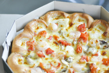 box of pizza on the table