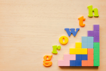 Alphabet and Puzzle on wooden background, Idea for Education growth or Business growth concept
