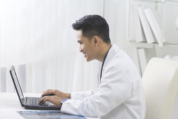 Medical doctor working with laptop in the office