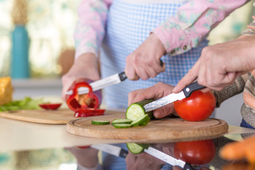 Family cooking Salad together
