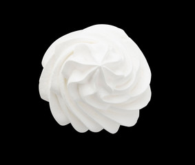 Frozen Yogurt. Whipped cream isolated on a black background with clipping path. Top view.
