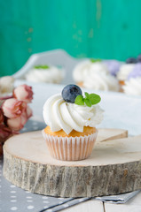 Summer cupcakes with blueberries and mint flavoured cream. Homemade.