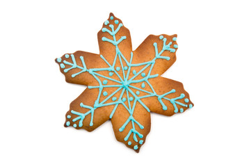 Gingerbread cookie in snowflake shape isolated on white background