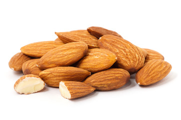 Heap of almond nuts isolated on white background