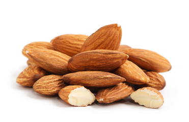 Heap of almond nuts isolated on white background