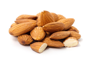 Heap of almond nuts isolated on white background