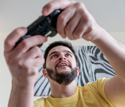 Bearded gamer with controller