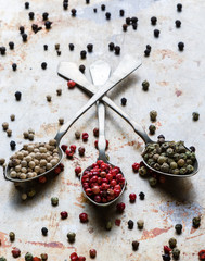 peppercorn seeds on vintage spoons