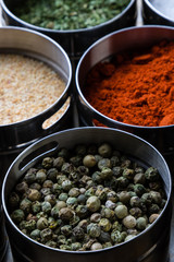 green peppercorn seeds in steel bowl