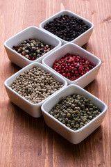 spices in white square bowls