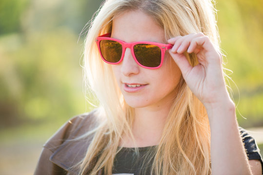 Fashionable girl in sunglasses, close up fashion beautiful woman portrait wearing sunglasses