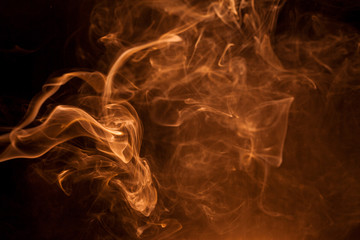 Gold smoke on a black backgroug.