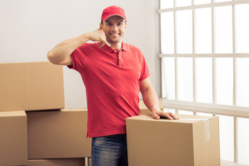 Handsome worker helping to move