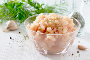 Healthy food background, raw minced meat in a bowl and various s