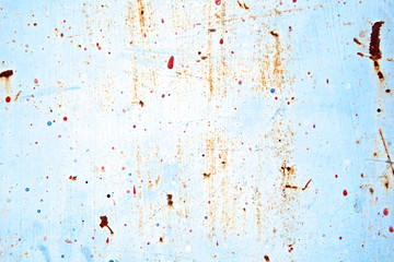 Vintage rusted texture grunge painted on blue wall background or Abstract scratched spatter on cracked plaster cement. Vintage and retro for poster background. High quality. Close up
