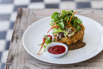 Deep fried chicken with salad and tomato ketchup on white plate