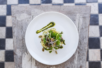 Mashed potato with fish steak and salad on white plate