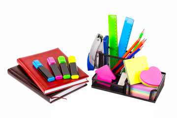 Stationery isolated on white. Notebooks, markers, pencils, rulers, stickers, stapler