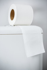 Hygienic paper on white toilet tank