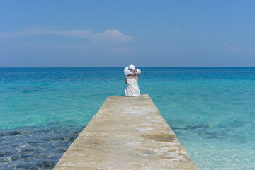 woman relaxing at the dock