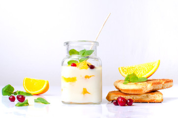 handmade yogurt with oranges on a white background