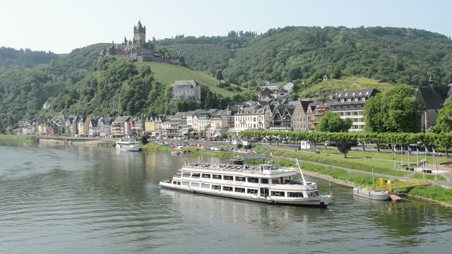 Cochem city with small mosel river habor and tourist boats for Mosel river touring. Cochem, Germany