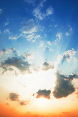 Skies are changing from blue to orange in the sunset.