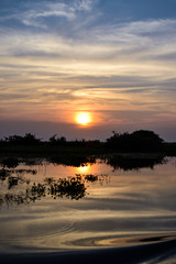 Obraz premium River sunset in Cambodia during summer