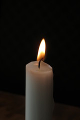 Fototapeta na wymiar Candle lit on a restaurant table