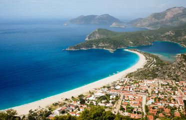 Town and beach on a coast of mediterranean sea.