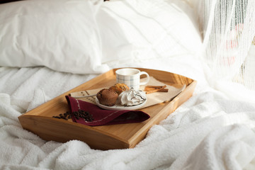 Sweet breakfast in bed with coffee